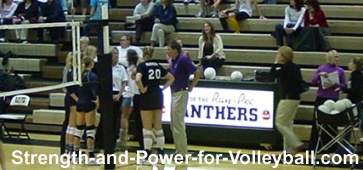 Volleyball officials communicating with teammates and scorekeeper